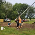 Raising the flagpole at the WI Vietnam War Memorial site